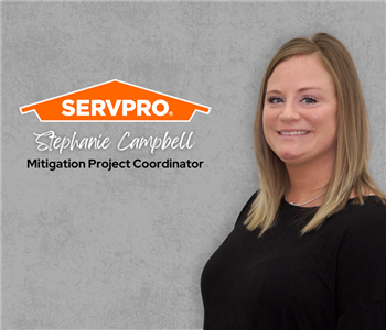 Servpro employee, woman in black polo