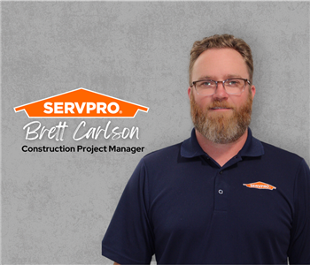 Servpro employee, man in black polo