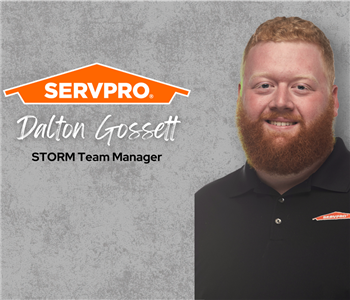 SERVPRO employee, man wearing black polo