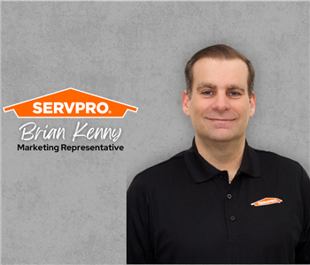 Servpro employee, man in black polo