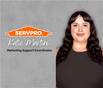 Servpro employee, woman in black polo