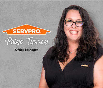 Servpro employee, woman in black polo